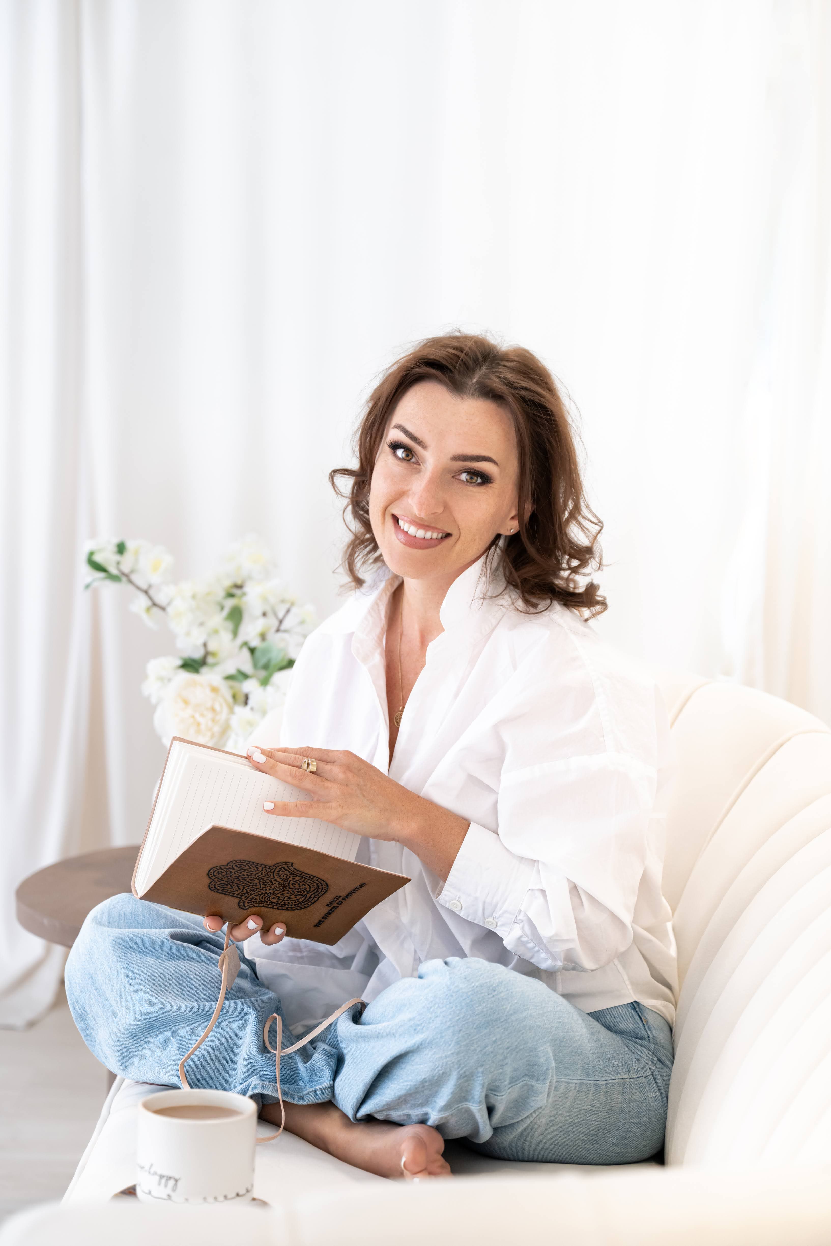 Julia Zoger holding a journal